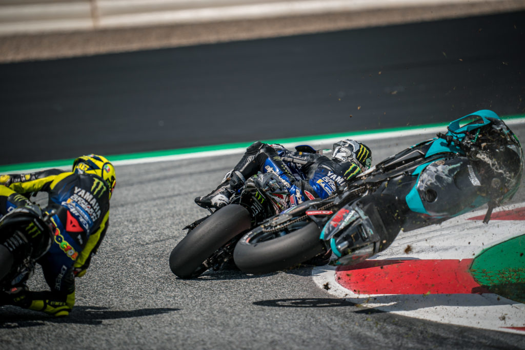 Franco Morbidelli's Petronas SRT bike flies between Yamaha riders Maverick Vinales and Valentino Rossi after crashing with Johann Zarco in the 2020 MotoGP Austrian Grand Prix