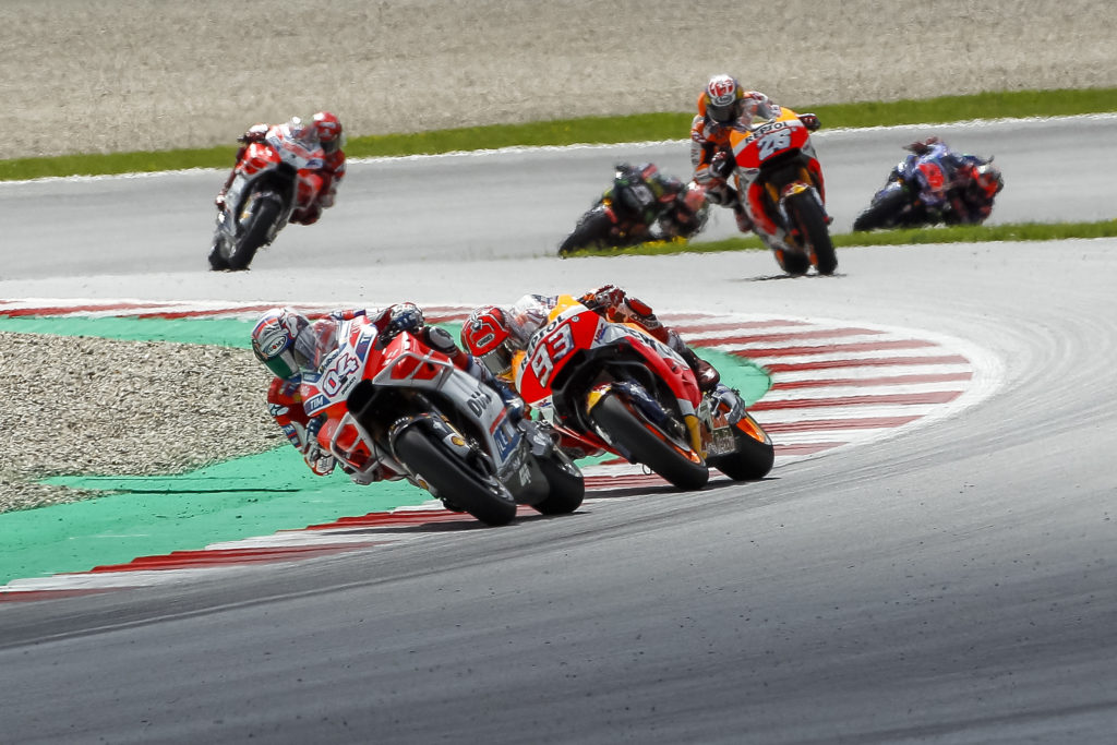 Ducati's Andrea Dovizioso and Honda's Marc Marquez battle to win the 2017 MotoGP Austrian Grand Prix