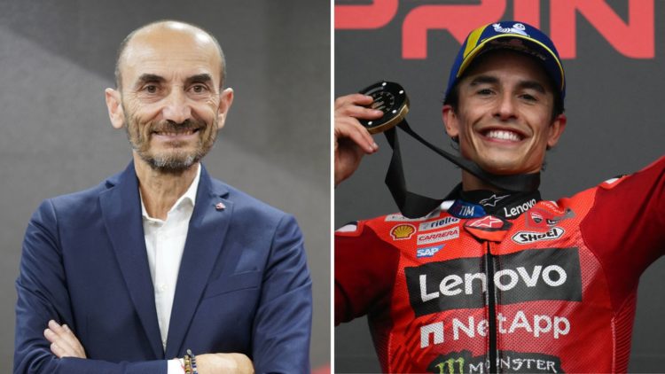 Claudio Domenicali CEO of Ducati poses at Ducati stand during the 110th edition of EICMA world cycle and motorcycle exhibition, and Marc Marquez ce...