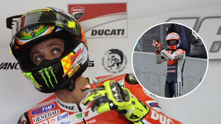 Valentino Rossi in the Ducati garage at the 2011 Spanish Grand Prix with an inset of Honda rival Casey Stoner after their crash at Jerez