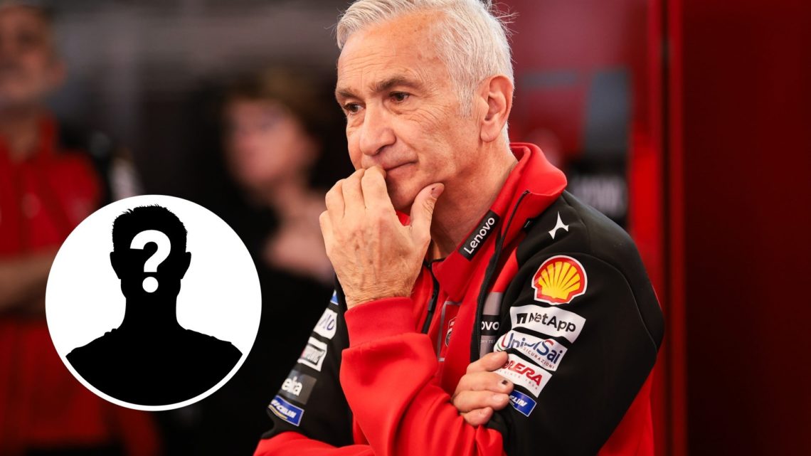 Ducati team boss Davide Tardozzi reacts in the garage with a mystery person inset
