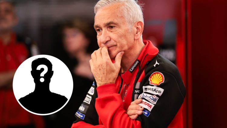 Ducati team boss Davide Tardozzi reacts in the garage with a mystery person inset