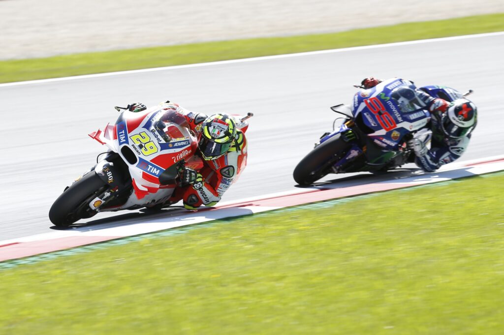 Ducati's Andrea Iannone on track with Yamaha's Jorge Lorenzo during the 2016 MotoGP Austrian Grand Prix