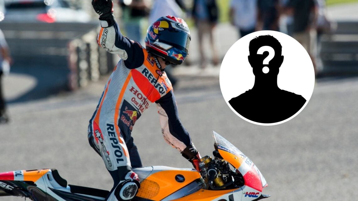 Dani Pedrosa atop a Honda bike waving to the crowd