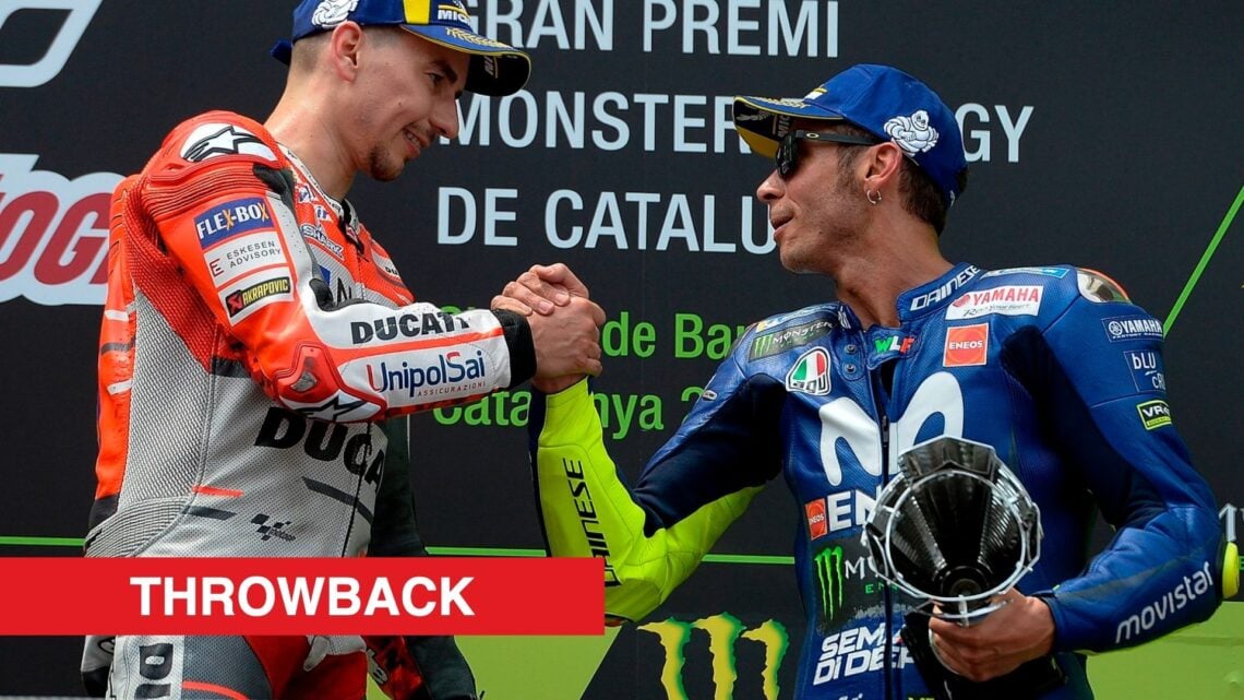 Valentino Rossi and Jorge Lorenzo shaking hands on the podium in Barcelona