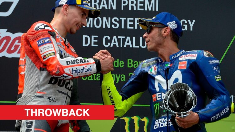 Valentino Rossi and Jorge Lorenzo shaking hands on the podium in Barcelona