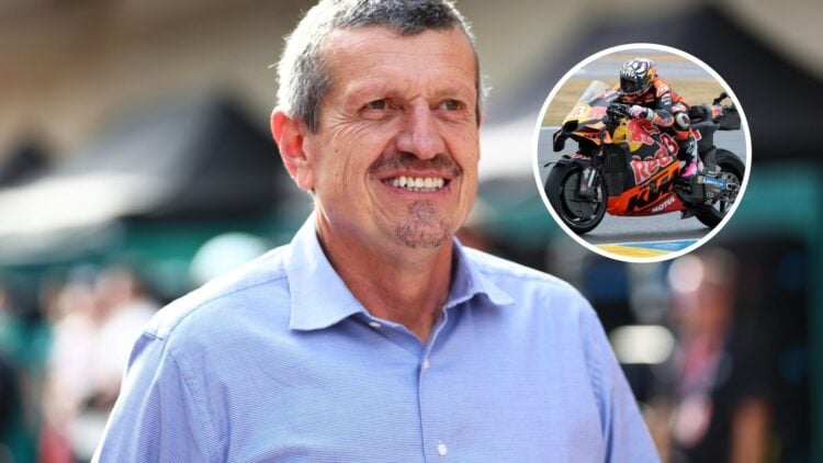 Guenther Steiner smiles as he walks through the F1 paddock, with a KTM bike in the overlay image