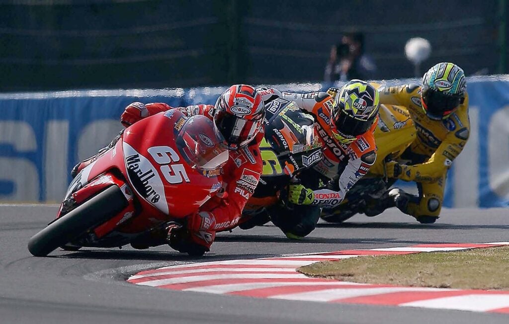 Loris Capirossi leads Valentino Rossi and Max Biaggi at the 2003 Japanese Grand Prix in Suzuka