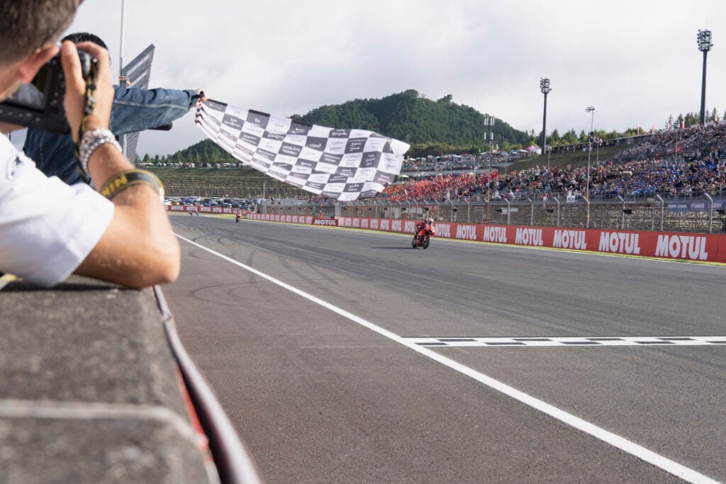 Francesco Bagnaia takes the chequered flag at the 2024 Japanese Grand Prix