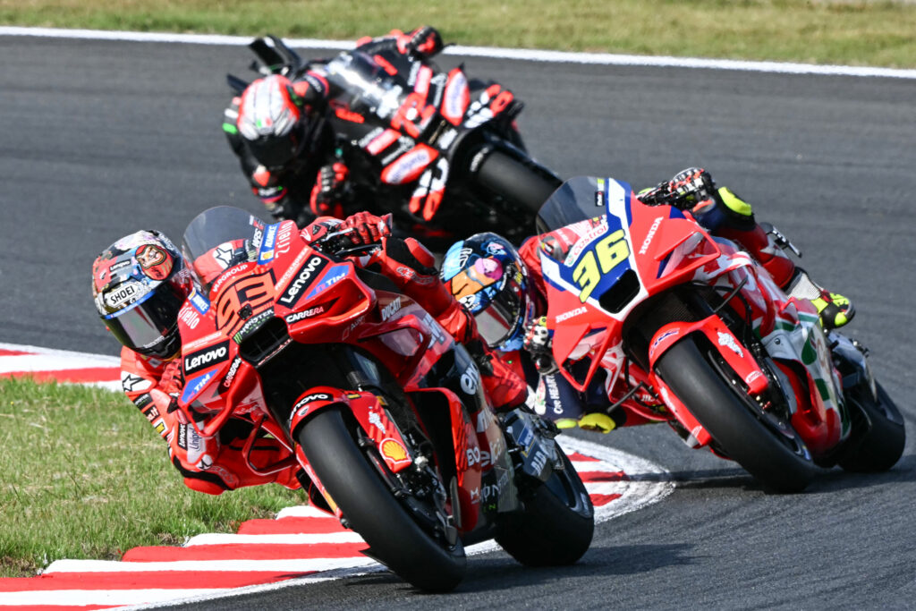 Joan Mir of Honda HRC and Marc Marquez of Ducati battle at the 2025 Japanese Grand Prix