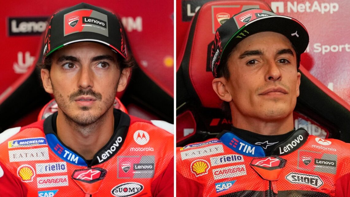 Ducati riders Francesco Bagnaia and Marc Marquez look on in the garage during practice for the 2025 MotoGP San Marino Grand Prix at Misano
