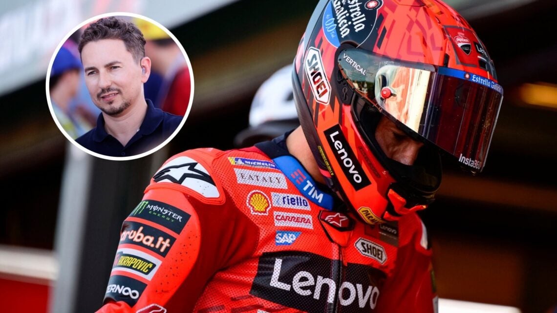 Marc Marquez in the MotoGP pit lane after qualifying for the San Marino Grand Prix, with Jorge Lorenzo standing during an interview in the overlay ...