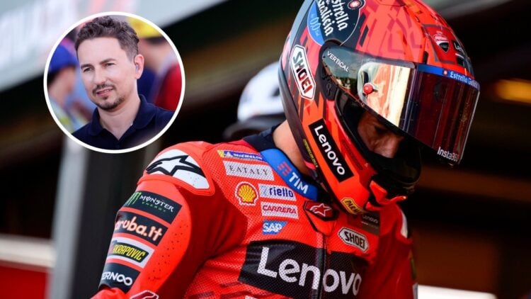 Marc Marquez in the MotoGP pit lane after qualifying for the San Marino Grand Prix, with Jorge Lorenzo standing during an interview in the overlay ...