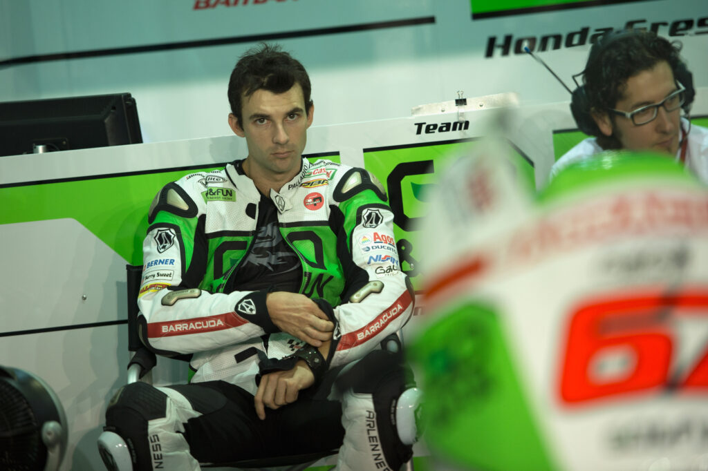 Honda Gresini rider Bryan Staring looks on from the garage at Lusail during practice for the 2013 MotoGP Qatar Grand Prix