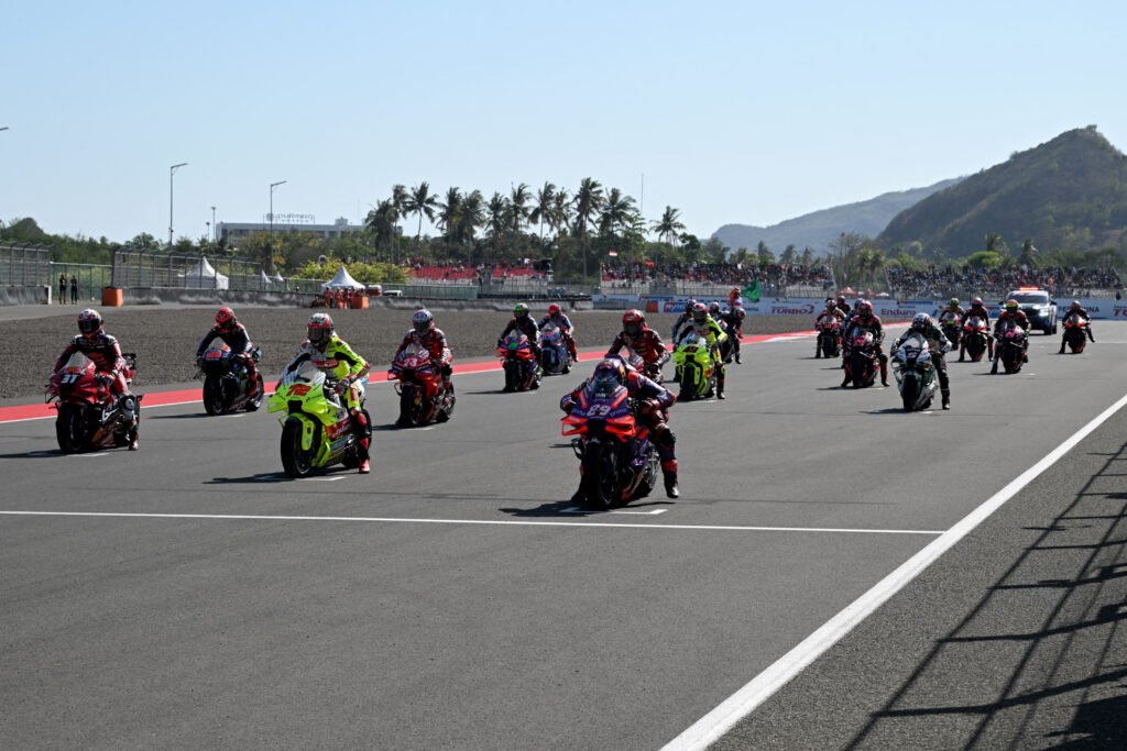 MotoGP riders line up on the Mandalika International Circuit grid ahead of the 2024 Grand Prix of Indonesia sprint race