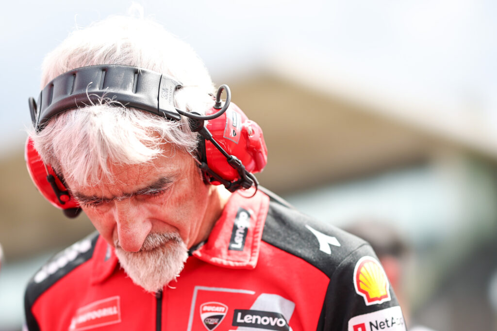 Luigi Dall'Igna of Ducati bows his head on the MotoGP grid