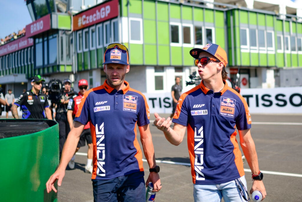 KTM's Brad Binder and Pedro Acosta walk out of the Brno pit lane at the 2025 MotoGP Czech Grand Prix