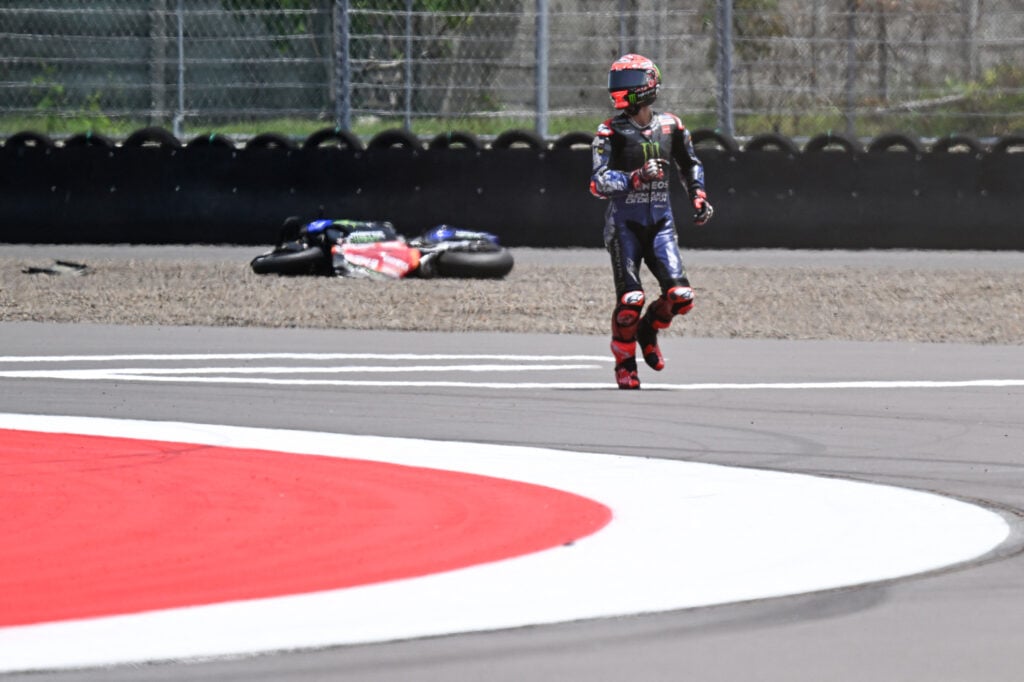 Yamaha rider Fabio Quartararo walks away after crashing during qualifying for the 2025 MotoGP Indonesian Grand Prix at Mandalika