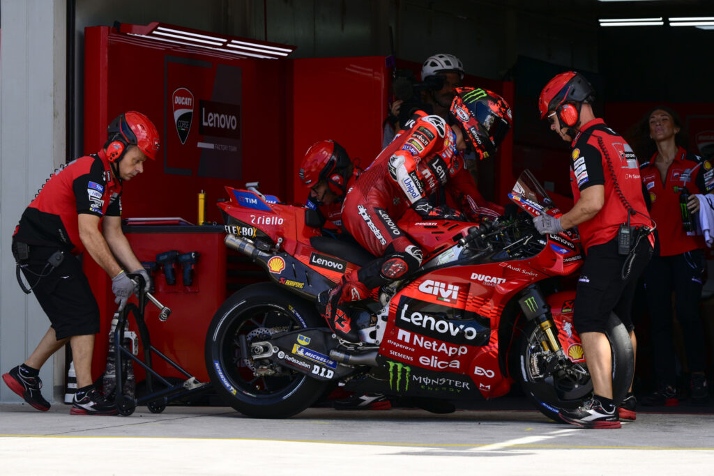Francesco Bagnaia getting off his bike in front of the Ducati garage during qualifying for the 2025 Grand Prix of Indonesia.