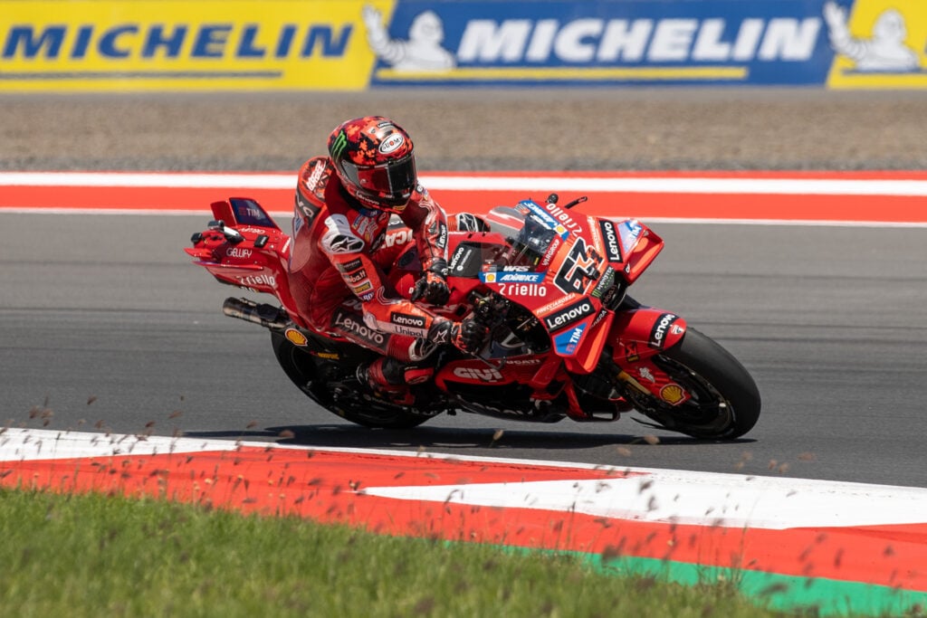 Francesco Bagnaia sits up as he rides the Ducati MotoGP bike at the Indonesian Grand Prix