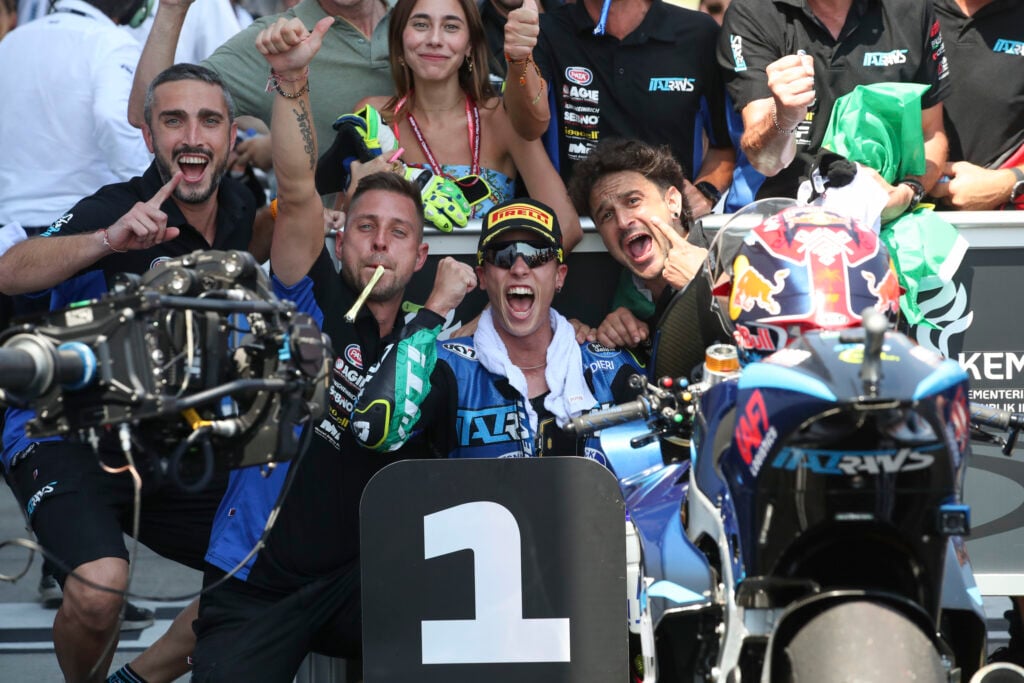 Italtrans rider Diogo Moreira celebrates winning the 2025 Moto2 Indoensian Grand Prix with his team at Mandalika