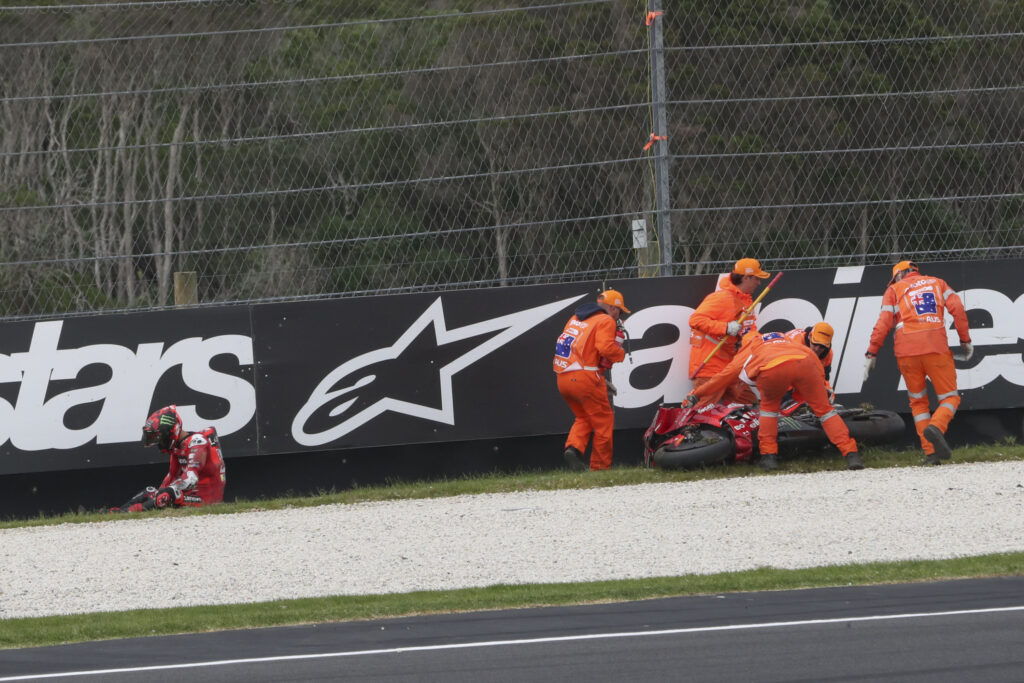 Ducati rider Francesco Bagnaia sits in the gravel trap at Phillip Island's Turn 6 after crashing out of the 2025 MotoGP Australian Grand Prix