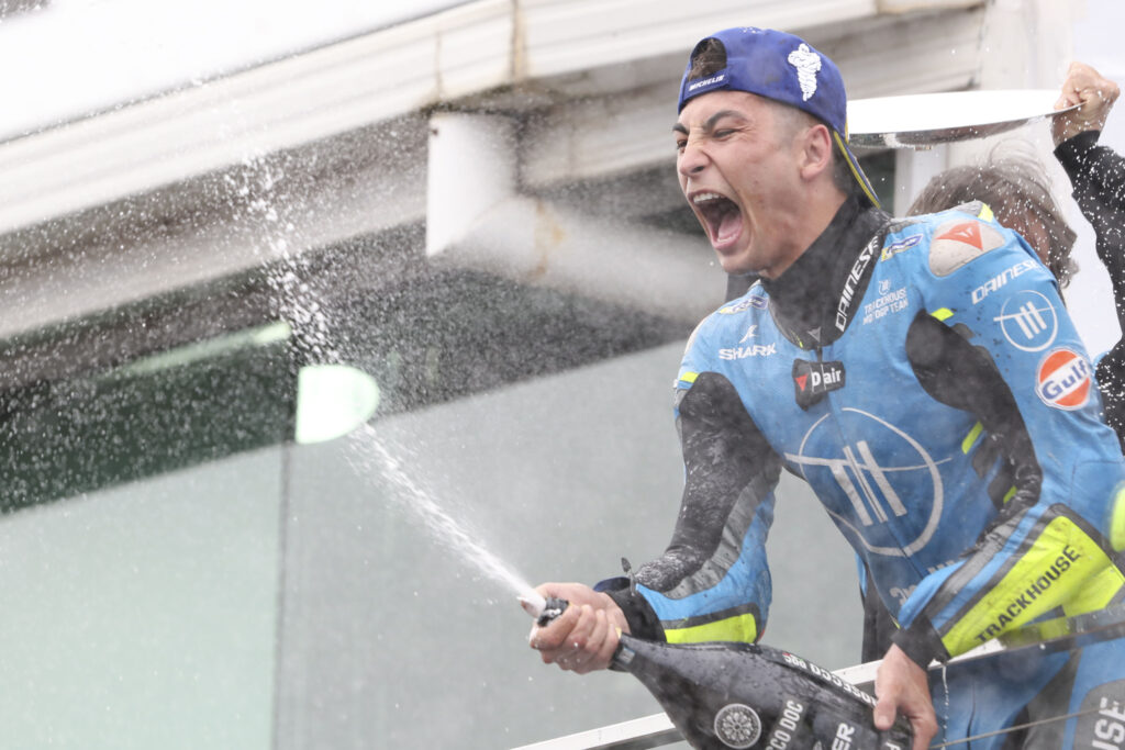 Trackhouse rider Raul Fernandez sprays champagne on the Phillip Island podium to celebrate his first MotoGP race win at the 2025 Australian Grand Prix