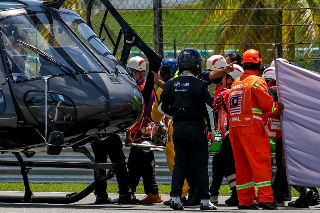 Paramedics moving Noah Dettwiler to the medical helicopter following a crash in Moto3 at the Malaysian Grand Prix.
