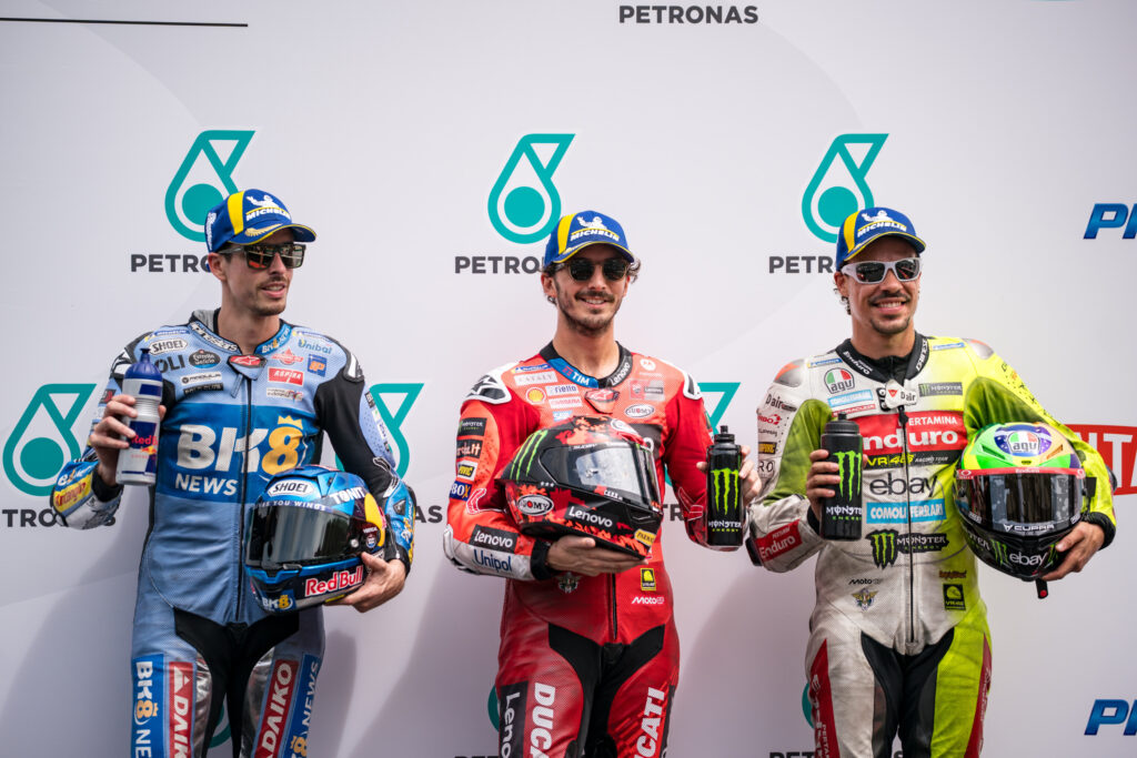 Ducati rider Francesco Bagnaia celebrates scoring pole position for the 2025 MotoGP Malaysian Grand Prix after qualifying at Sepang