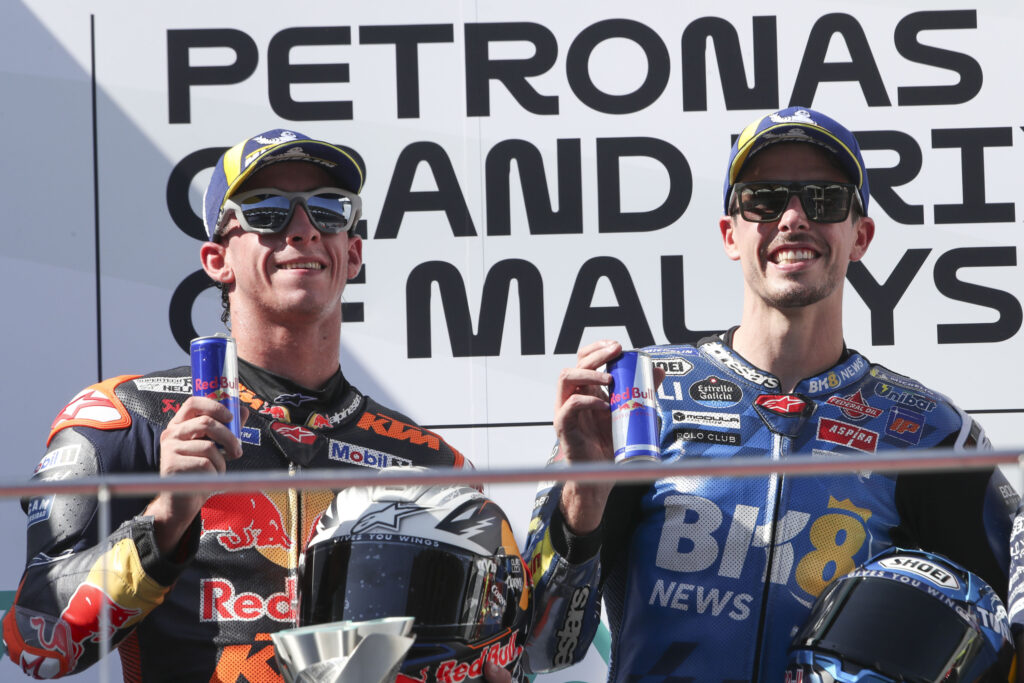 KTM's Pedro Acosta and Gresini's Alex Marquez celebrate on the Sepang podium after finishing the 2025 MotoGP Malaysian Grand Prix and second and first