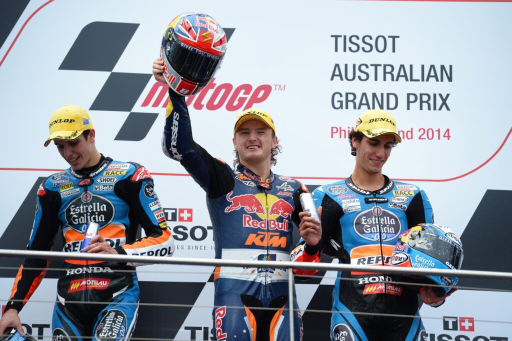Jack Miller celebrates winning the 2014 Moto3 Australian Grand Prix with Alex Marquez and Alex Rins on the Phillips Island podium