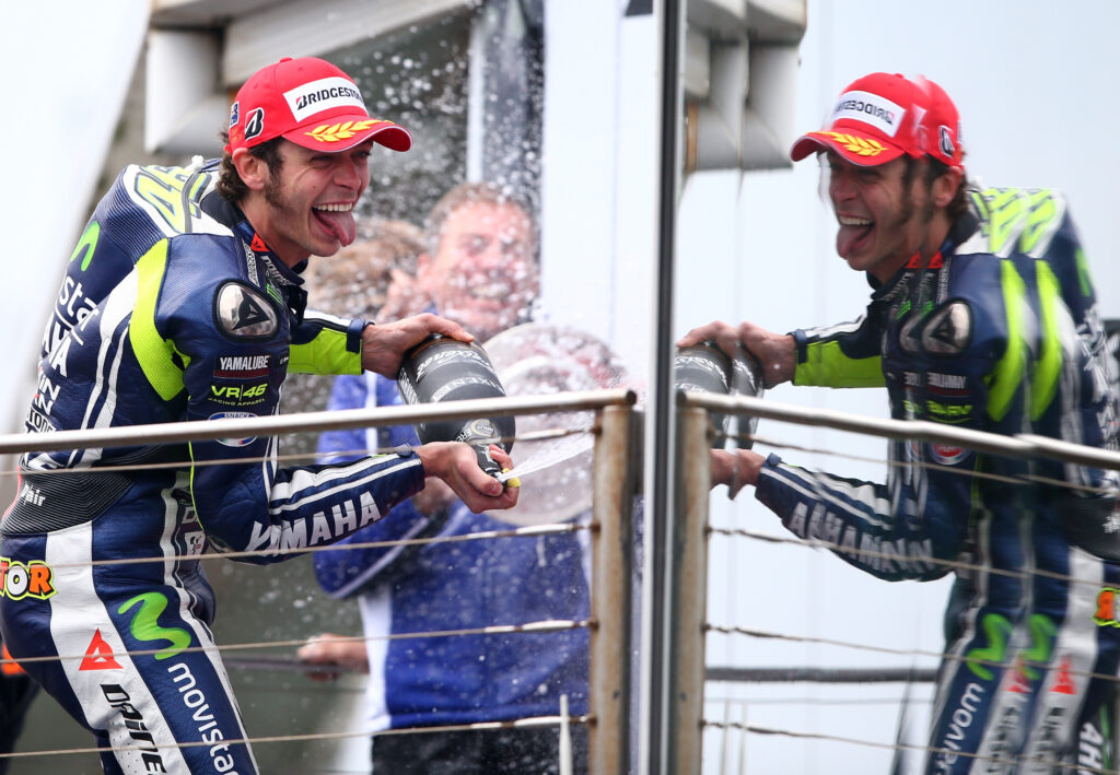 Valentino sprays champagne with his tongue out after winning the 2014 Australian Grand Prix