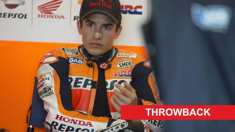 Marc Marquez of Honda sits in the garage at the 2013 United States Grand Prix, with a Throwback banner
