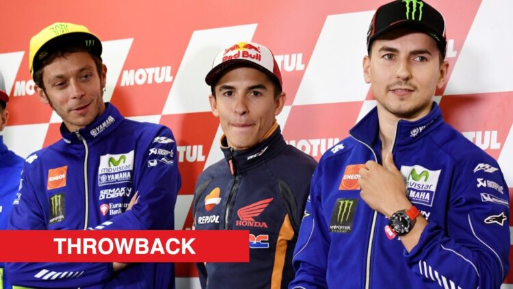Valentino Rossi, Marc Marquez and Jorge Lorenzo standing side-by-side during a MotoGP pre-event press conference.
