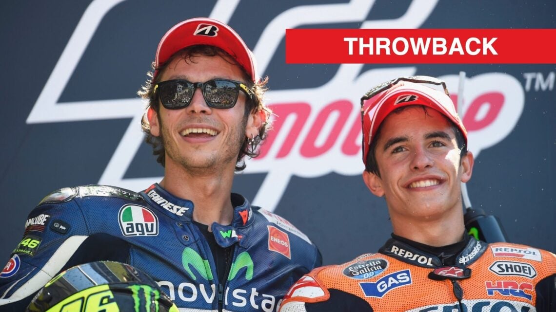 Valentino Rossi and Marc Marquez smile for a picture atop the MotoGP podium in 2014.