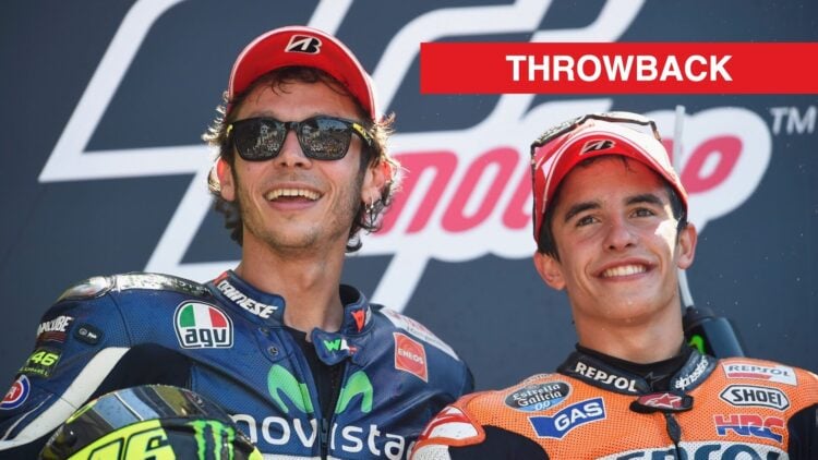 Valentino Rossi and Marc Marquez smile for a picture atop the MotoGP podium in 2014.