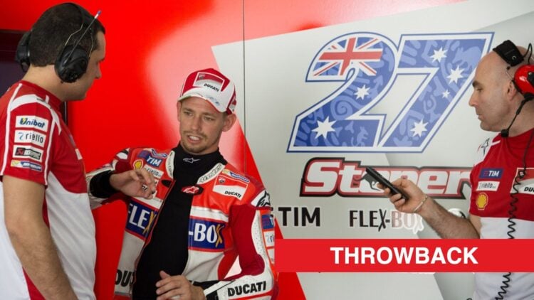 Casey Stoner talking to Ducati engineers during his test with the team in Sepang, Malaysia.