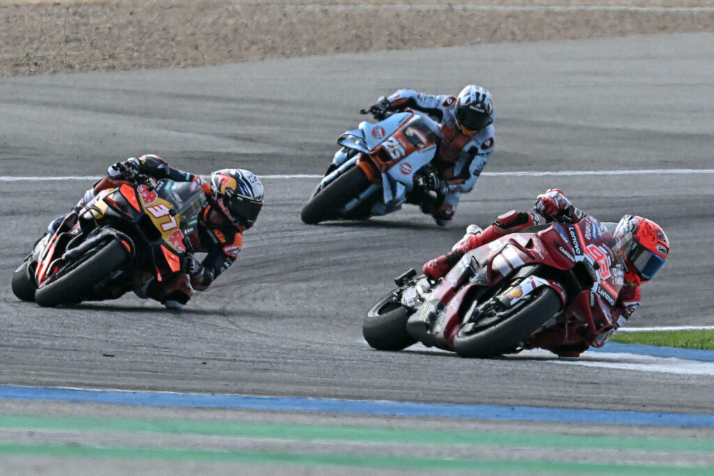 KTM rider Pedro Acosta follows Ducati's Marc Marquez on track during the Sprint Race at the 2026 MotoGP Thailand Grand Prix