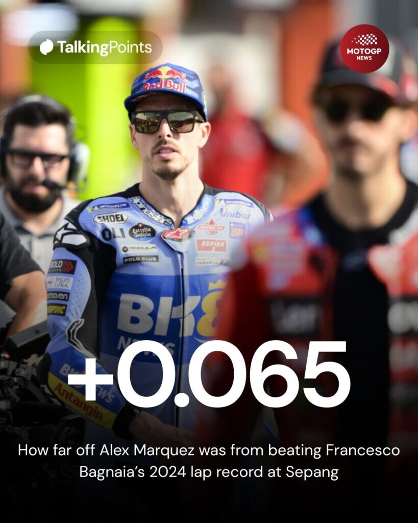 Alex Marquez walking through the MotoGP paddock behind Francesco Bagnaia.