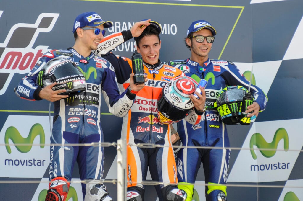 Jorge Lorenzo, Marc Marquez and Valentino Rossi pose on the podium after the 2016 MotoGP Aragon Grand Prix