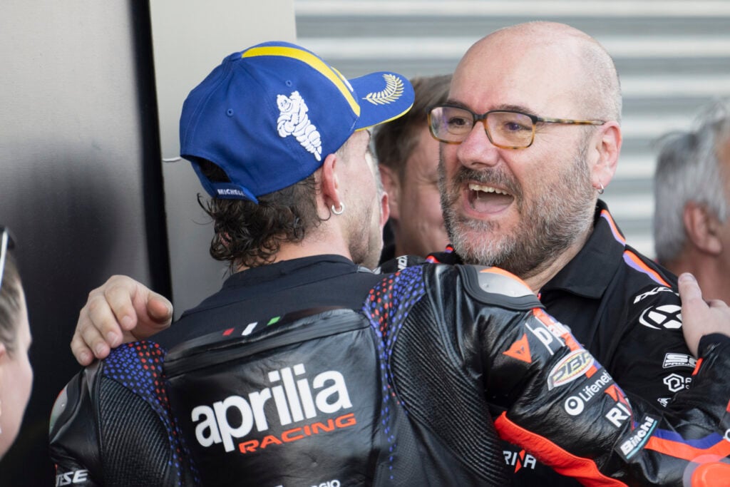 Aprilia rider Marco Bezzecchi and technical director Fabiano Sterlacchini celebrate after the Thai Grand Prix.