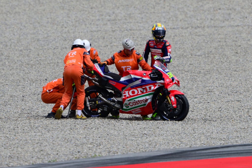Marshals remove Joan Mir's Honda after crashing during practice at the 2026 MotoGP Catalan Grand Prix