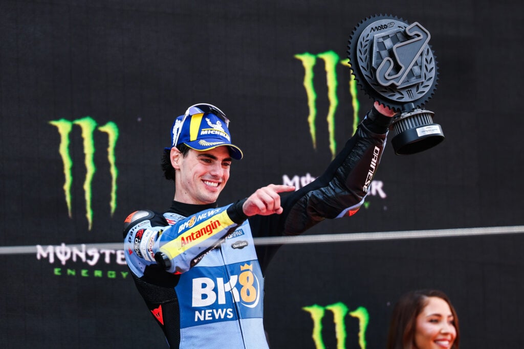 Fermin Aldeguerre of Gresin celebrates on the podium of the Catalan Grand Prix.