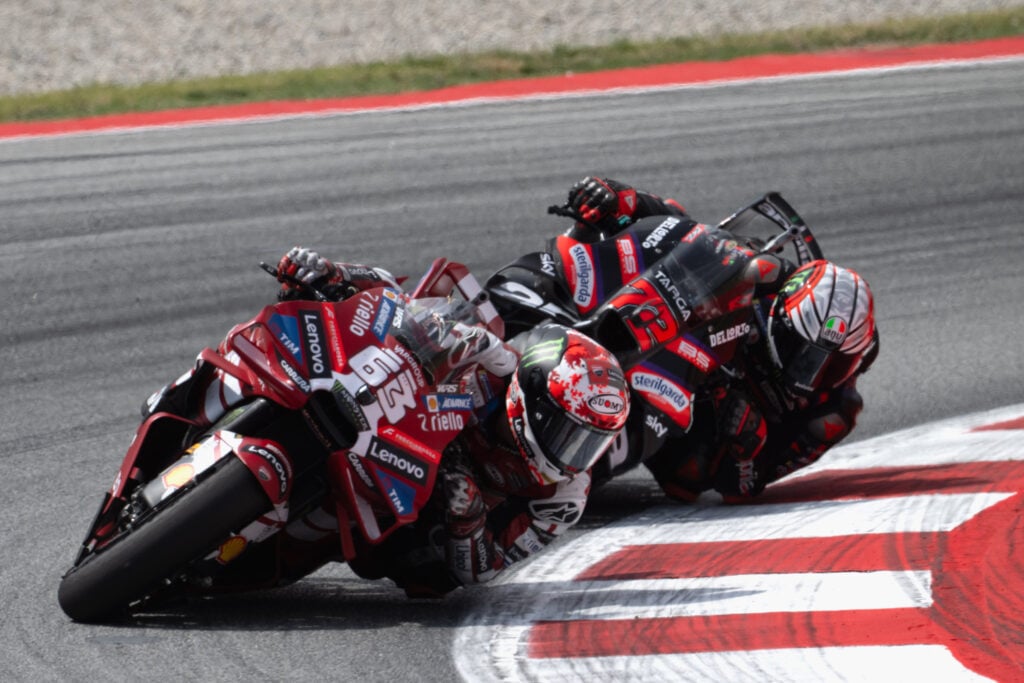 Ducati rider Francesco Bagnaia leads Aprilia's Marco Bezzecchi at the 2026 MotoGP Catalan Grand Prix.