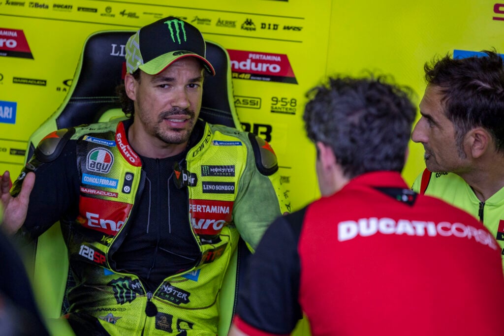 VR46 Ducati rider Franco Morbidelli talks to his mechanics in the garage at the 2026 MotoGP Hungarian Grand Prix.