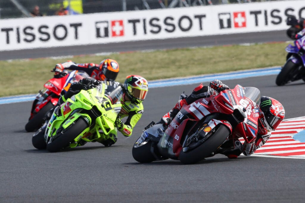 Ducati rider Francesco Bagnaia leads the VR46's Fabio Di Giannotto during the 2026 MotoGP Hungarian Grand Prix at Balaton Park.