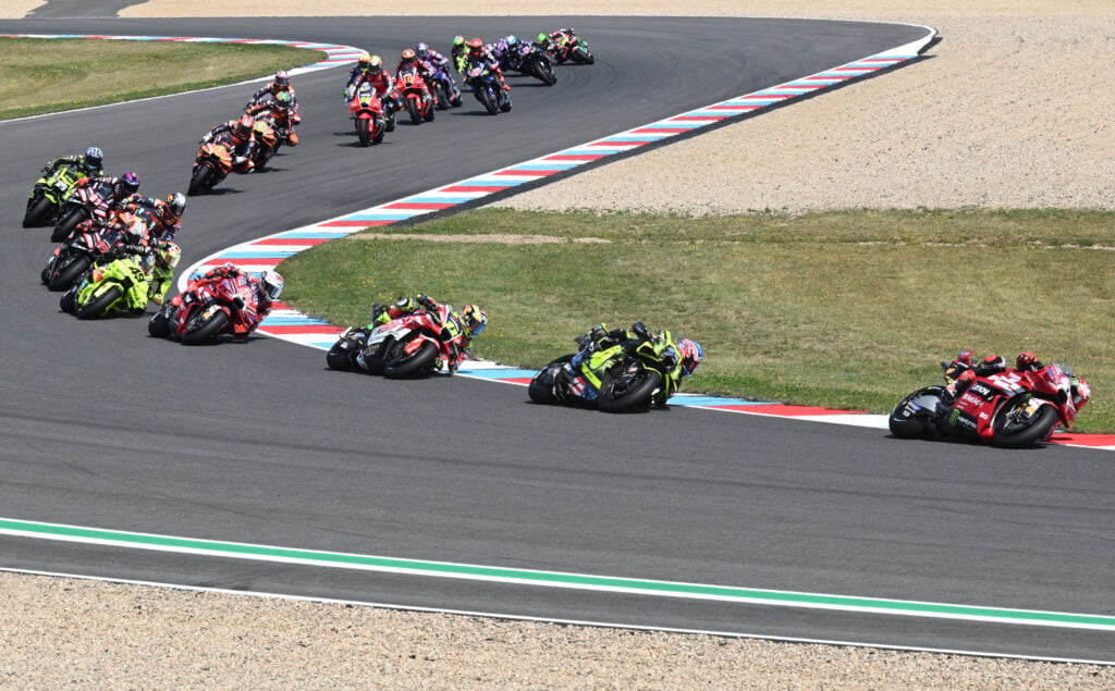 Ducati rider Francesco Bagnaia leads Ai Ogura en route to winning the Sprint Race at the 2026 MotoGP Czech Grand Prix