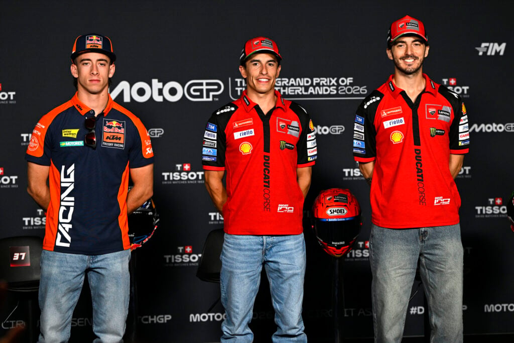 KTM's Pedro Acosta poses with Ducati's Marc Marquez and Francesco Bagnaia during a press conference at the 2026 MotoGP Dutch Grand Prix.