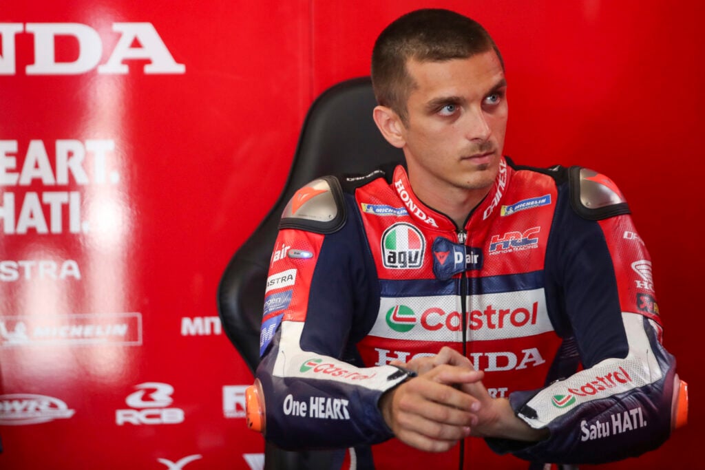 Luca Marini looks on from the Honda garage during practice for the 2026 MotoGP Dutch Grand Prix.