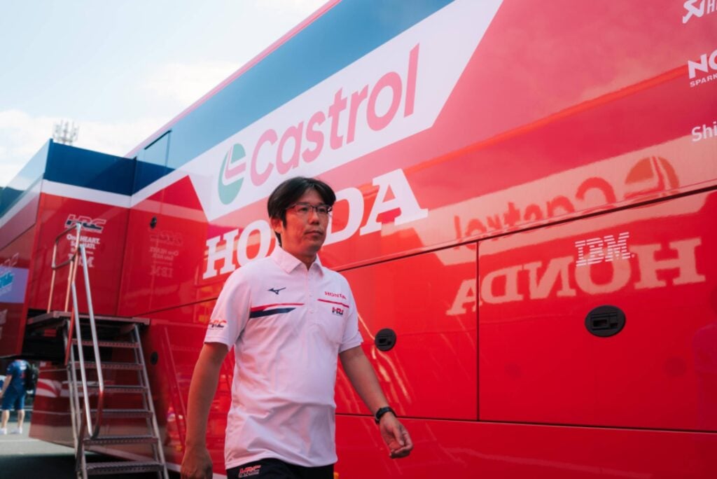 2027 Honda MotoGP team manager Mikihiko Kawase is seen leaving the engine bay.